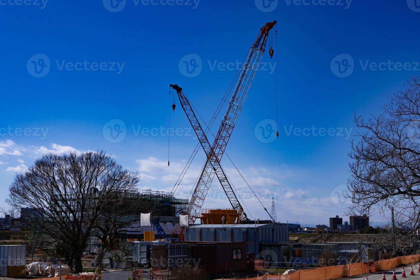 Cranes at the under construction daytime in Tokyo wide shot photo