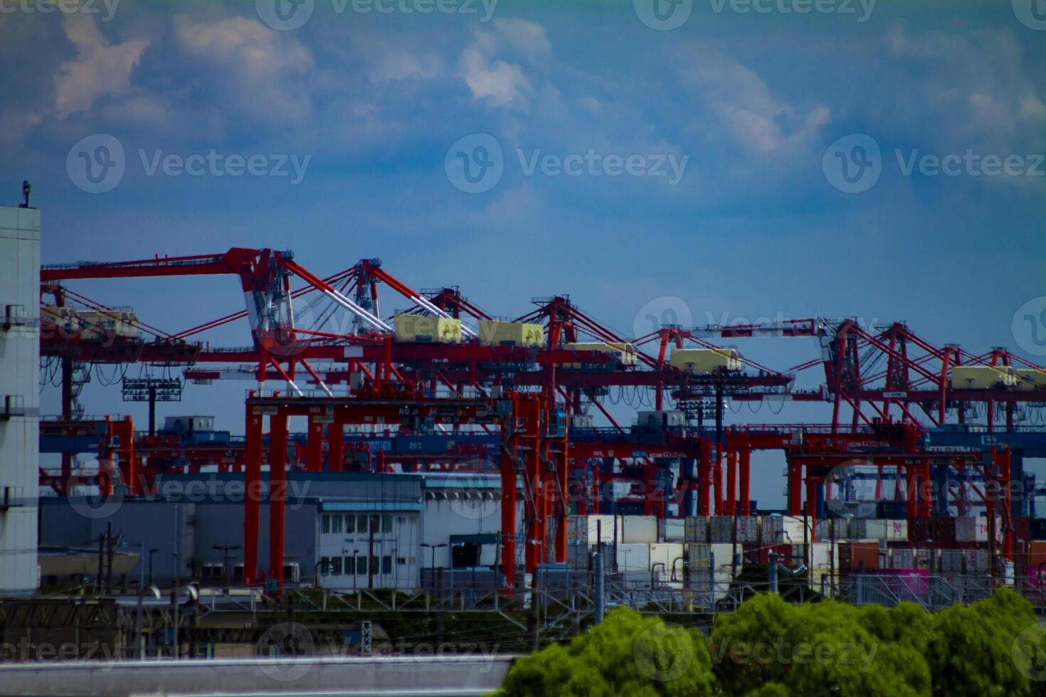 Moving cranes near the warehouse in Tokyo long shot photo