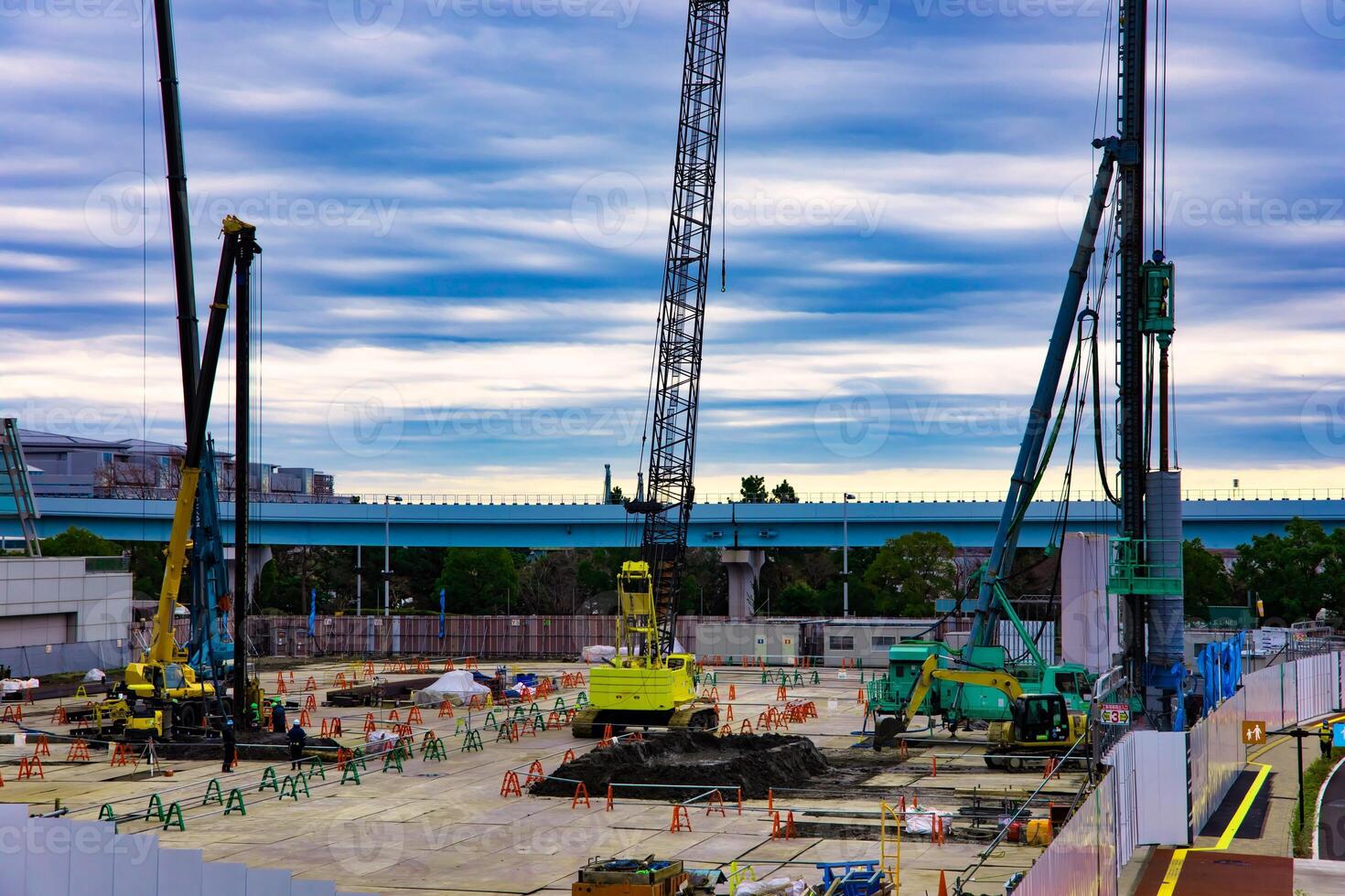 Cranes at the under construction near the railway photo