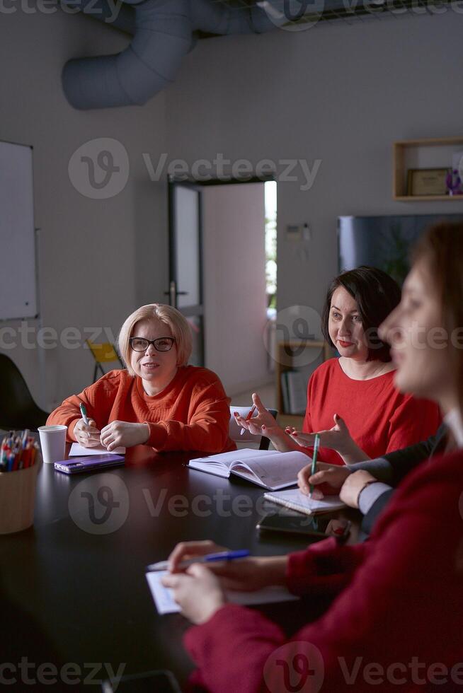 a person with a disability at a meeting in the office photo