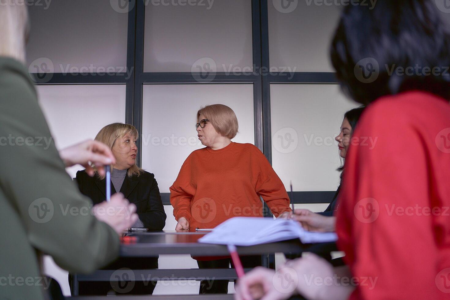 a person with a disability speaks at a meeting in the office photo