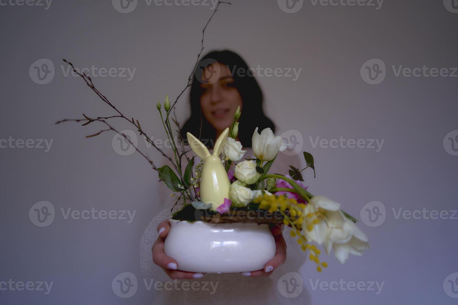 female florist make decorations and floral arrangements for Easter photo