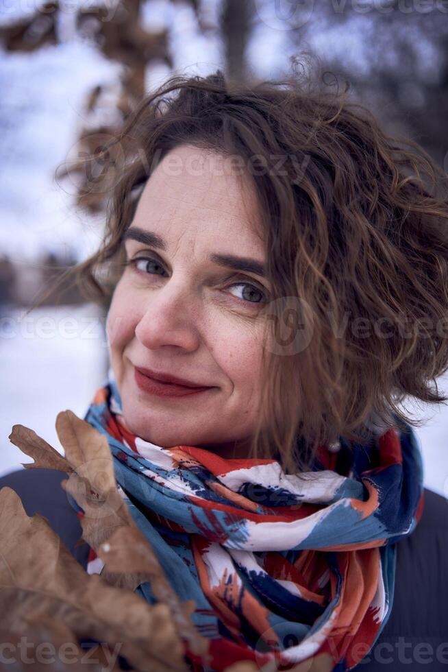 woman play with snow in forest photo