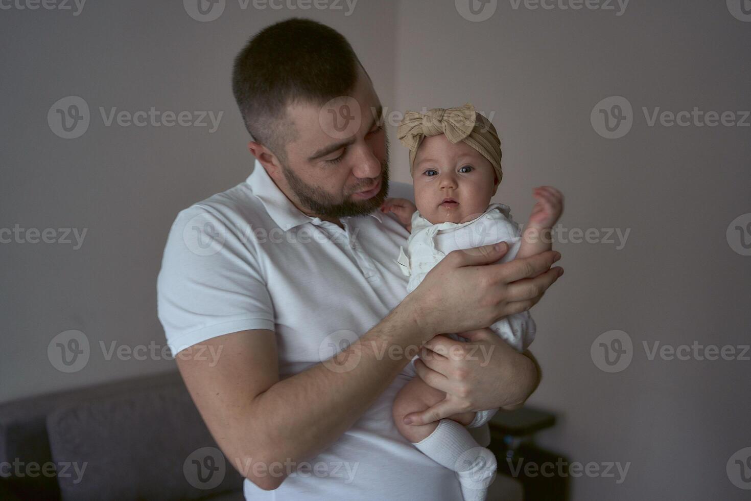 father plays with his daughter photo