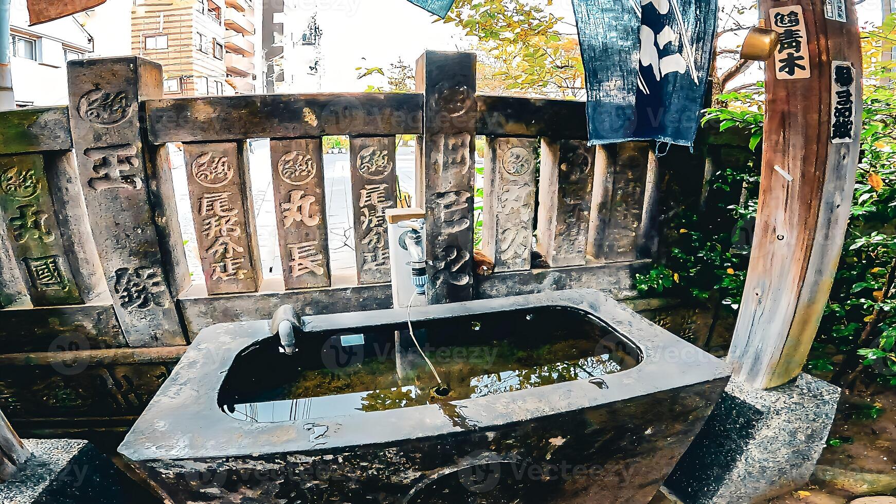 a shrine with a water purification facility.Japan, Osaki Inari Shrine, Namiyoke Inari Shrine, located in Tsukuda, Chuo Ward, Tokyo photo
