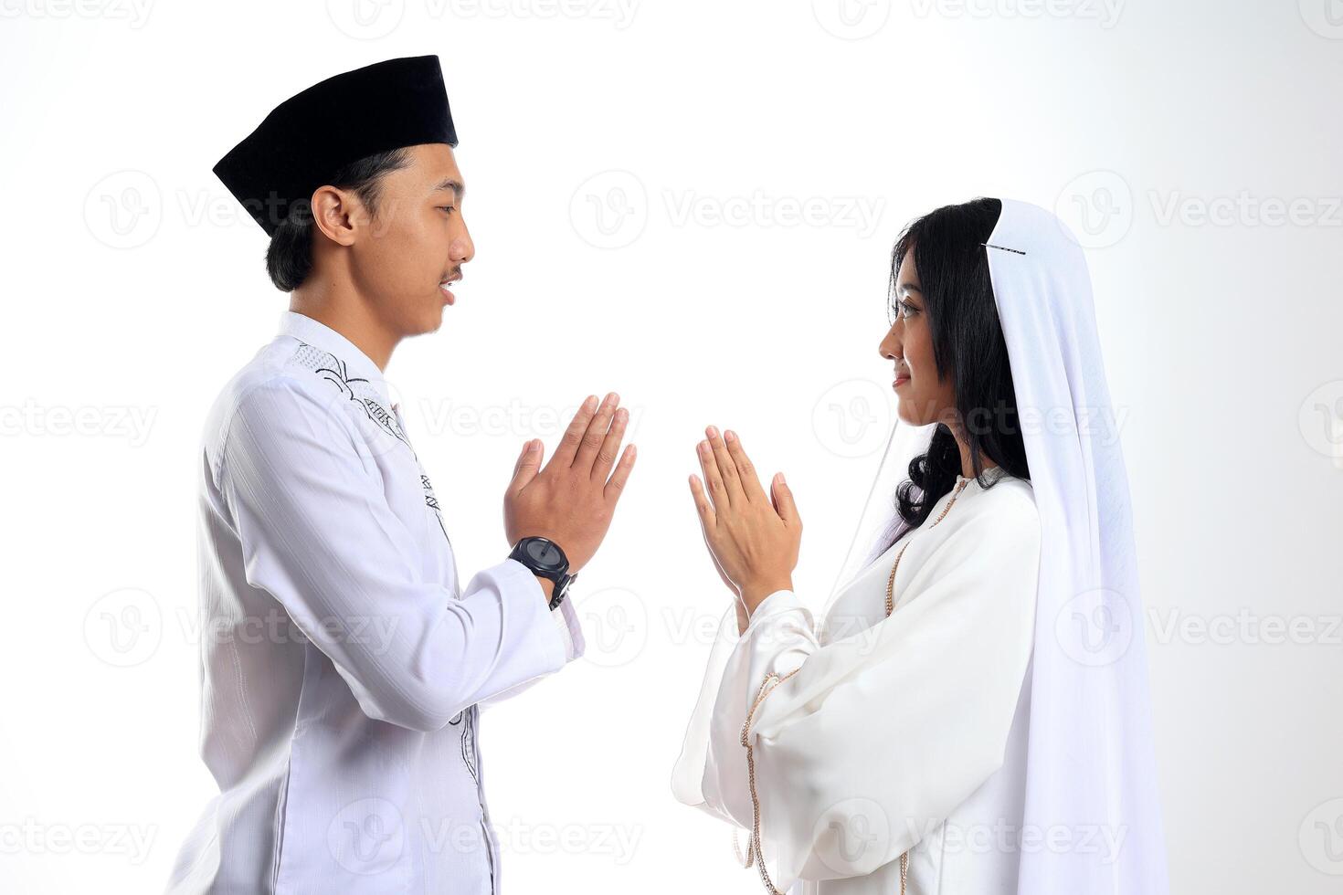 Muslim Asian Indonesian Couple Forgiving on Eid Mubarak photo