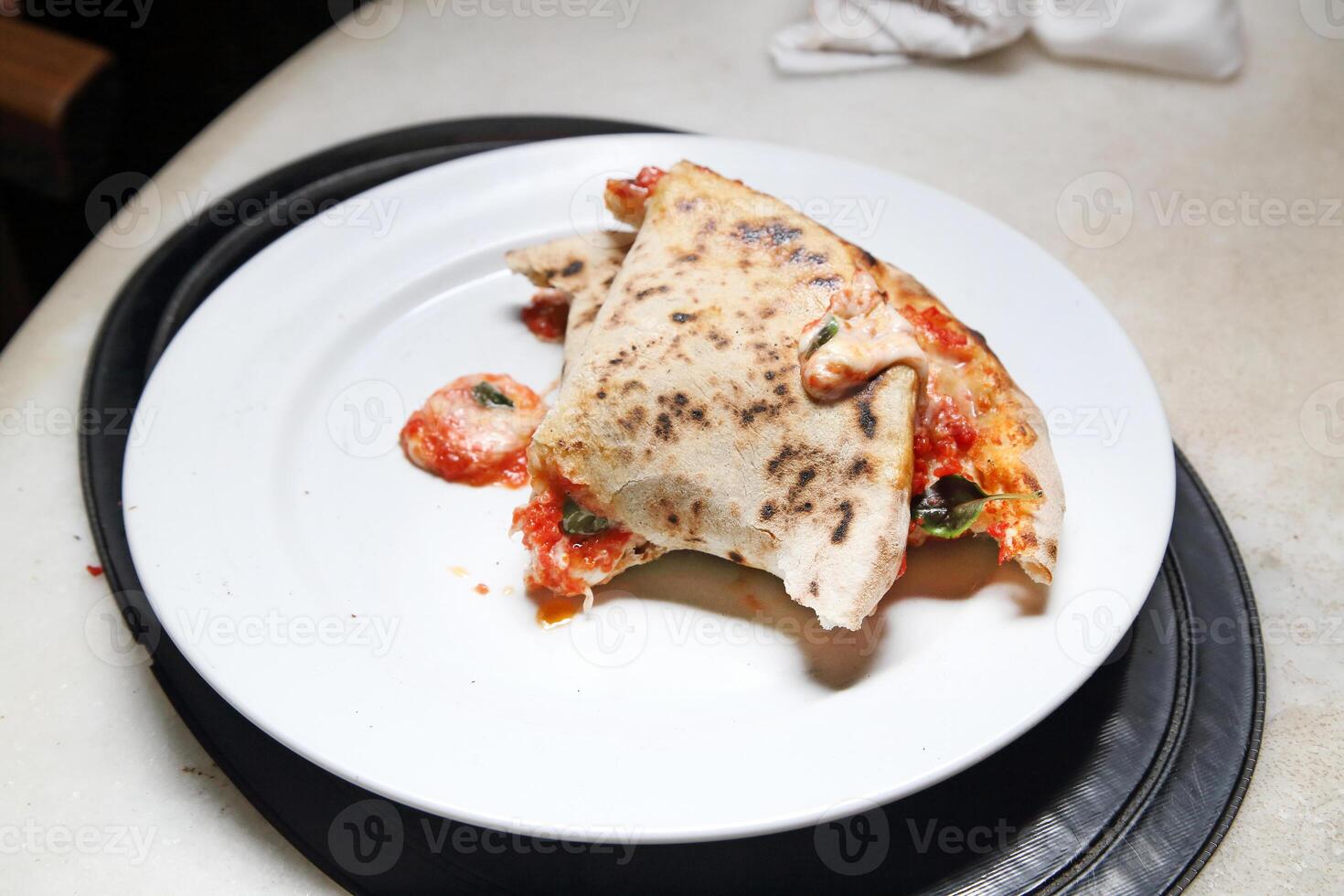 step-by-step guide on how to eat authentic Neapolitan pizza with your hands photo