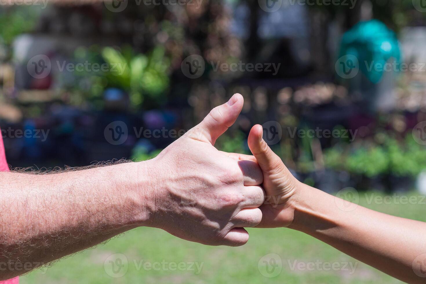 Close-up of hands man and woman showing signals of success and good photo