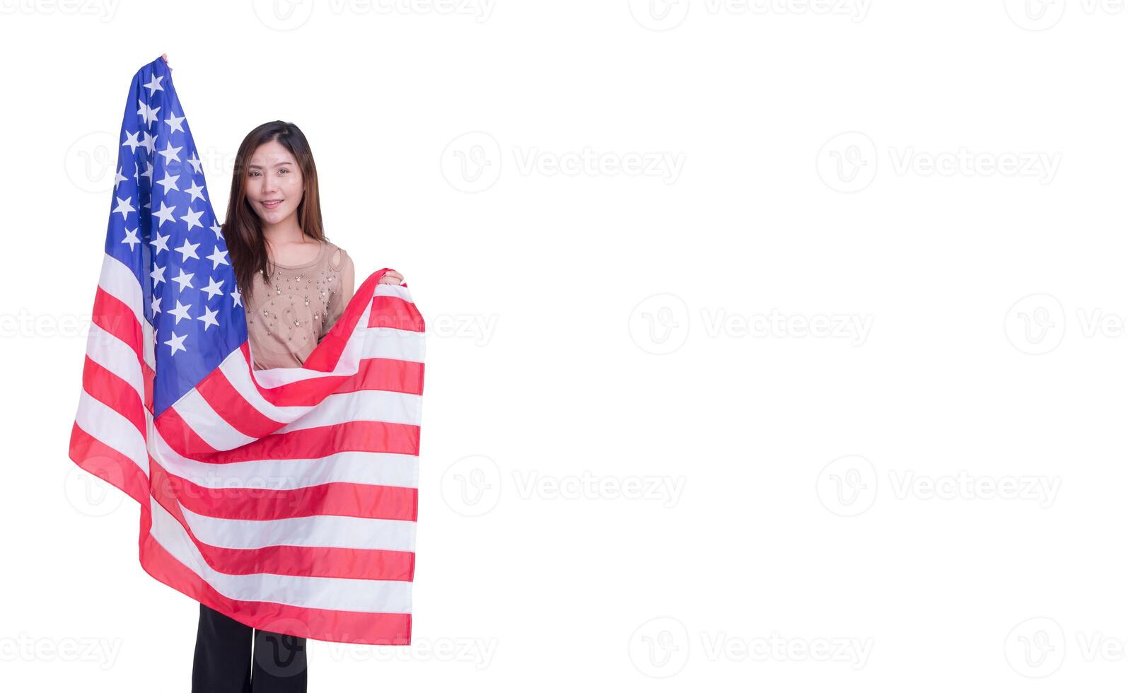 Young woman holding an American flag with a white background. Space for Text. 4th of July. Celebrate American National Day. Labor Day. Independence Day and more photo