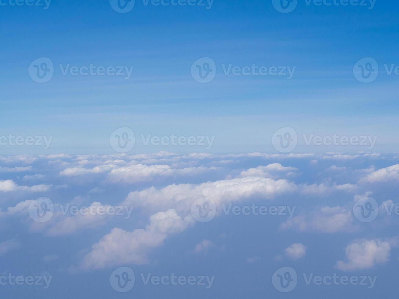 Aerial view of sky seen through the airplane window. Space for text photo