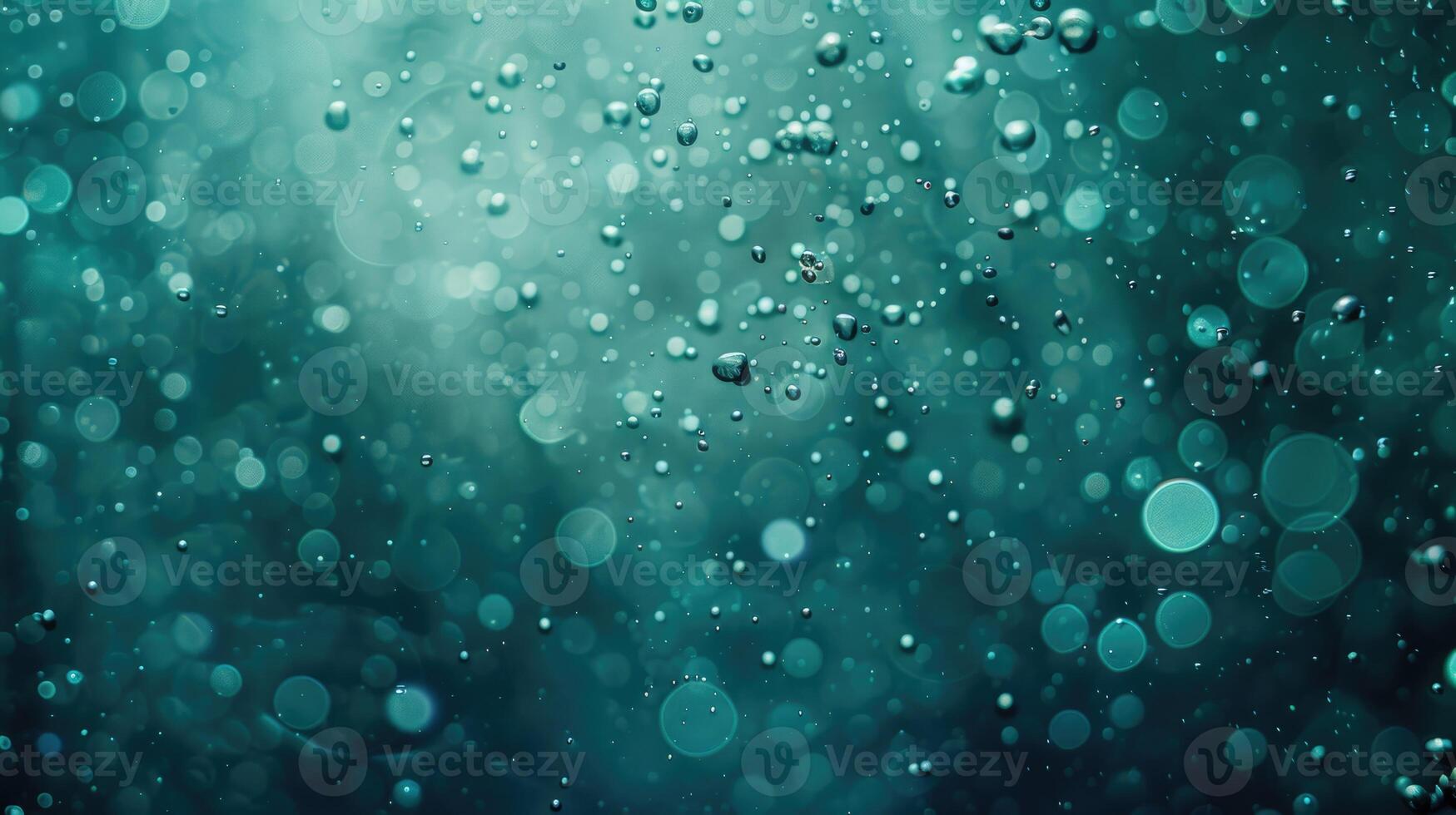 Bubbles and bokeh beneath the surface of the ocean turquoise green photo