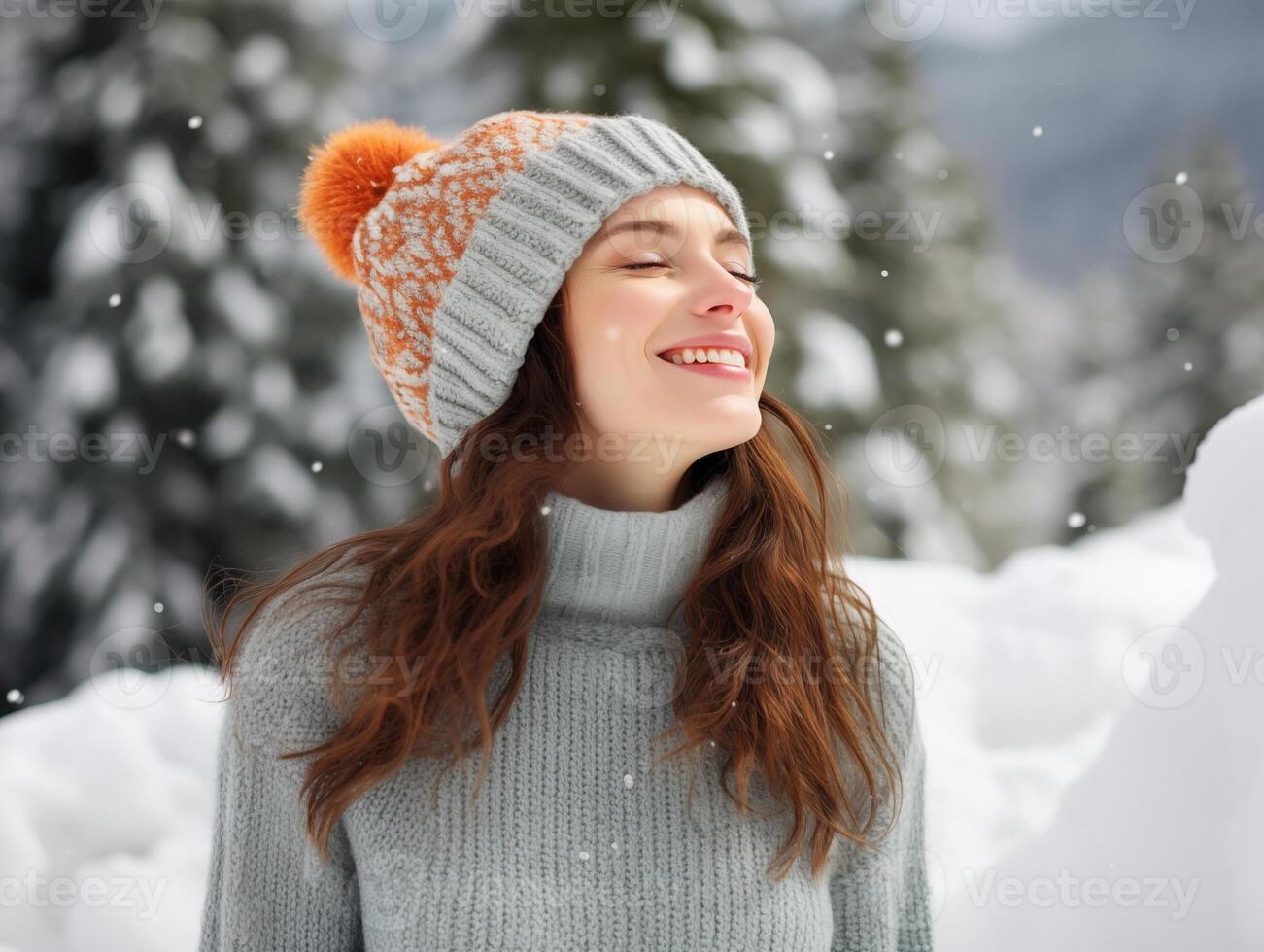 Happy Caucasian young woman in knitted hat and white wool sweater on winter background photo