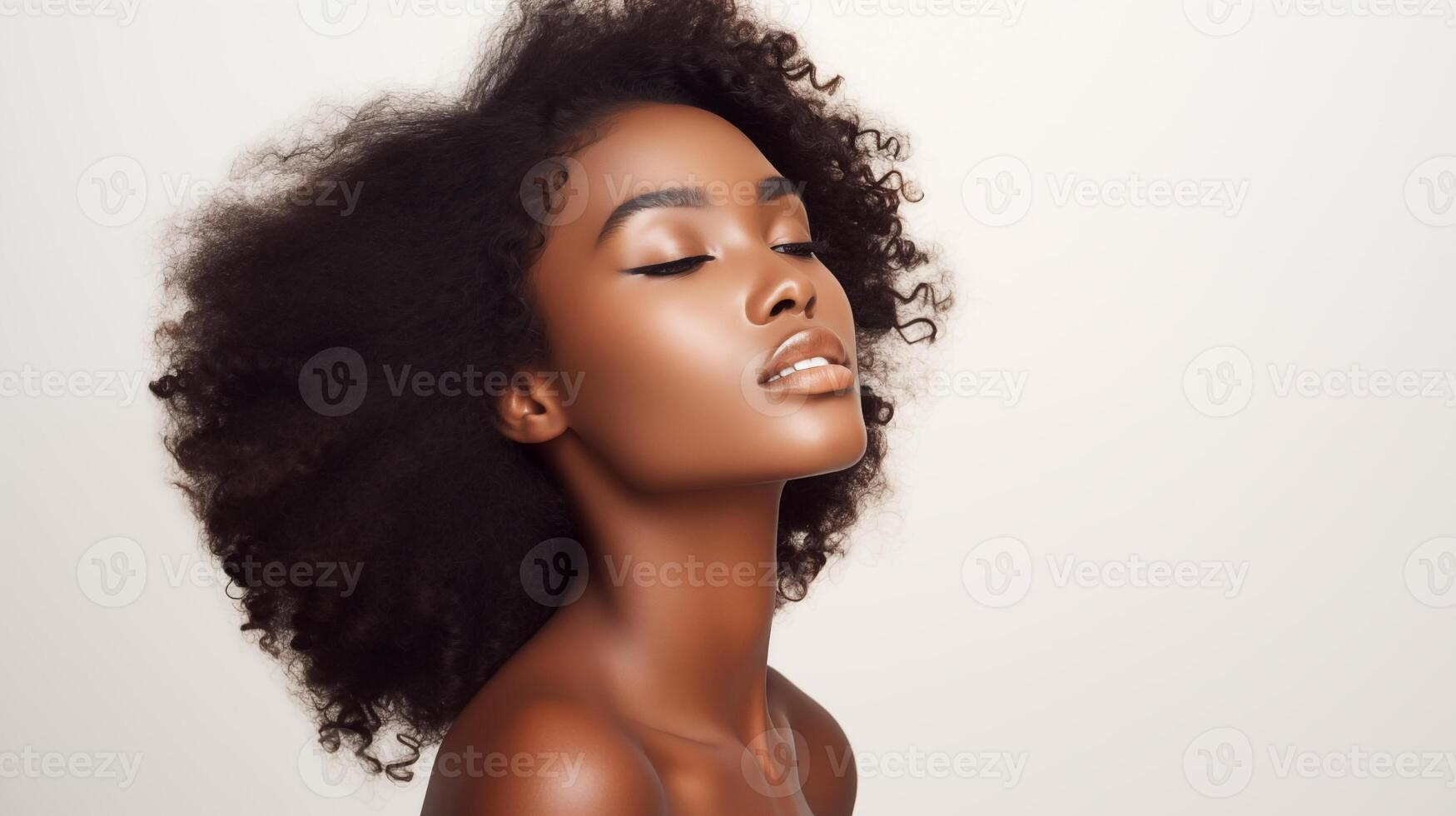 Beautiful young black woman with glowing healthy skin close-up. Advertising of cosmetics, perfumes, copy space photo