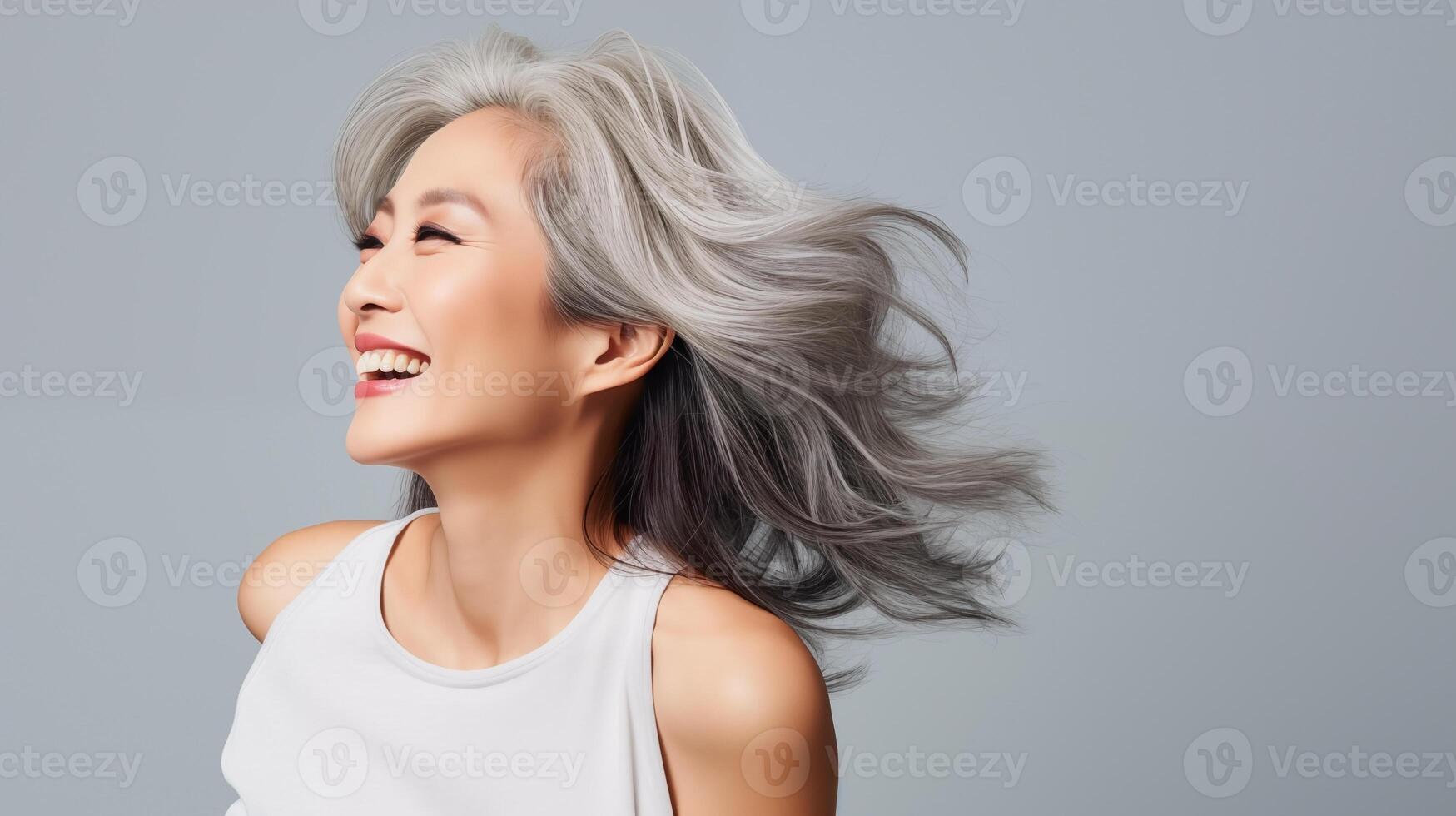 Beautiful mature asian woman with glowing healthy skin close-up. Advertising of cosmetics, perfumes, copy space photo