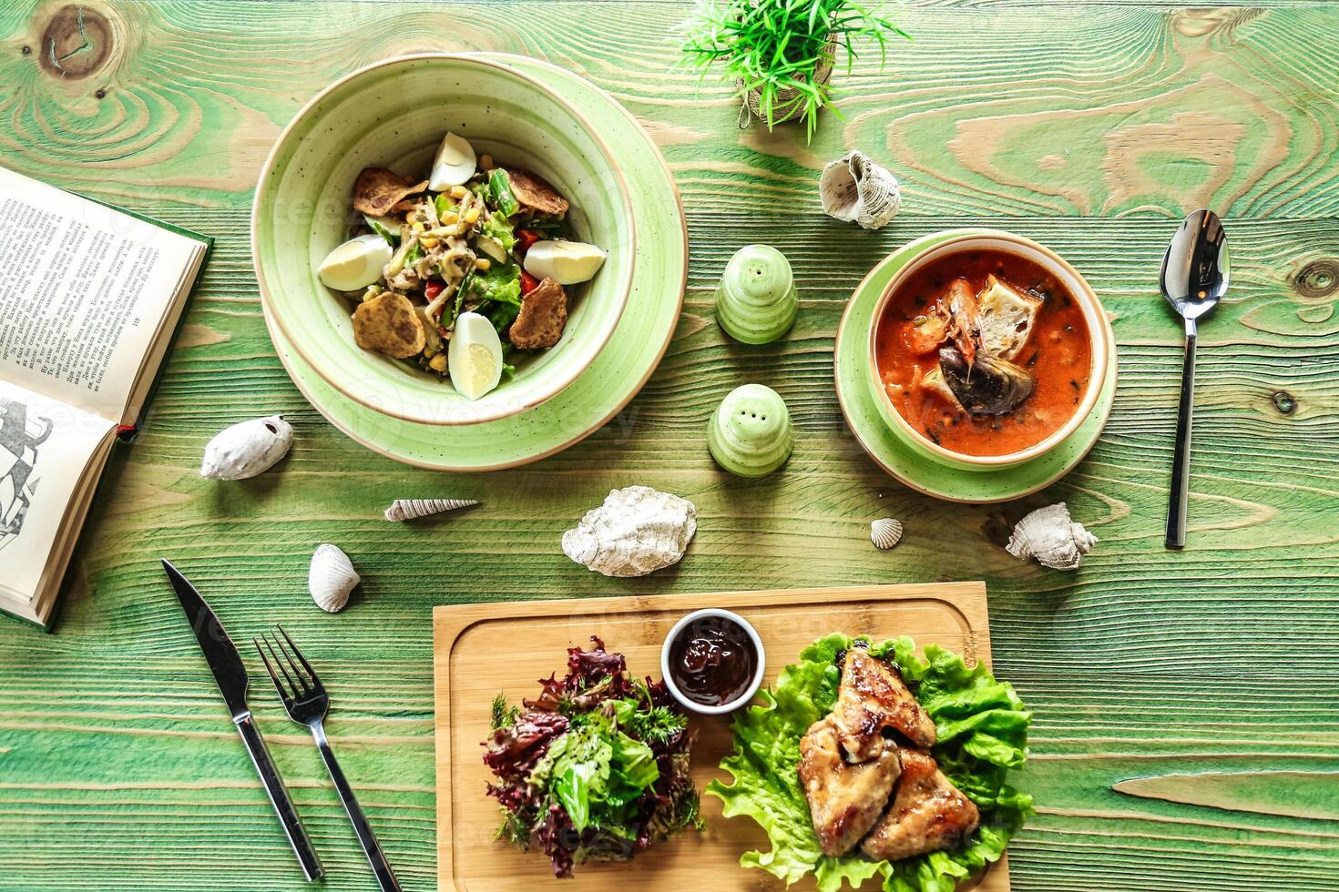 Wooden Table With Assorted Food Bowls photo
