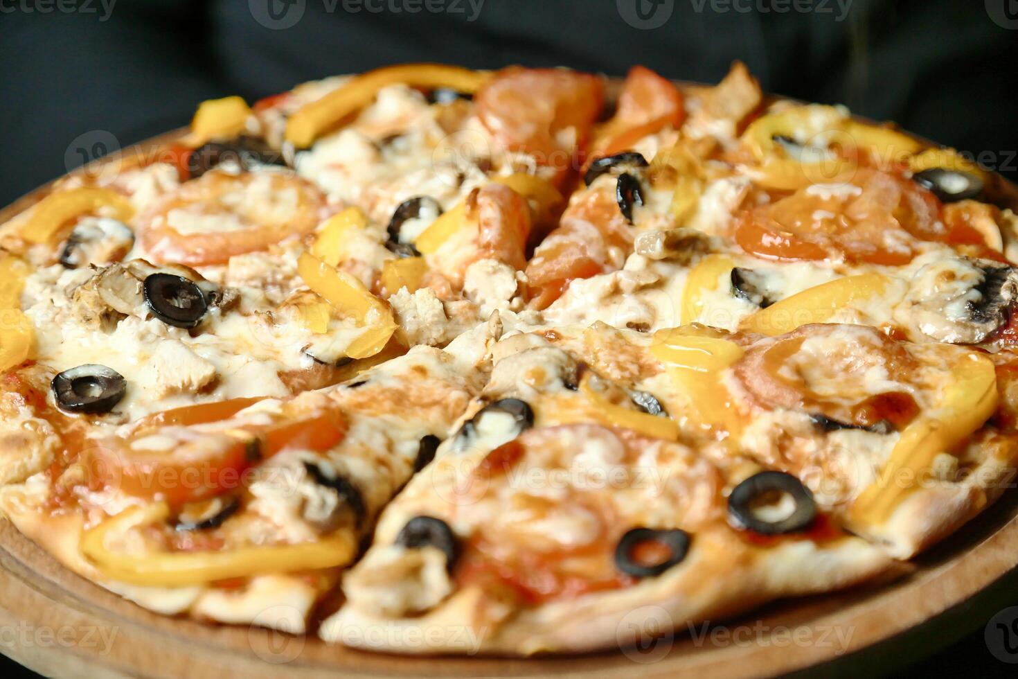 Pizza on Wooden Plate photo