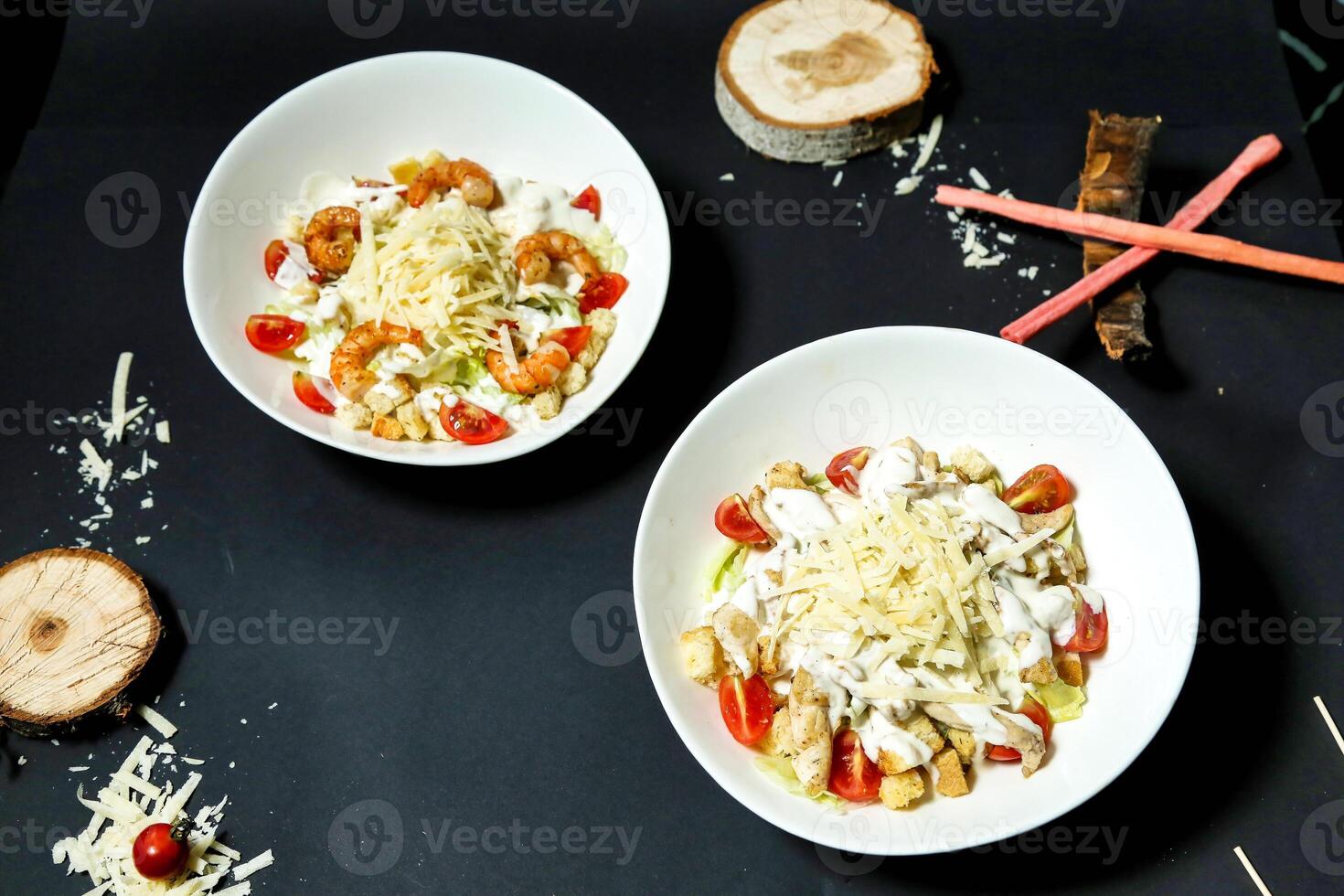 Two Bowls of Food on Table With Chopsticks photo