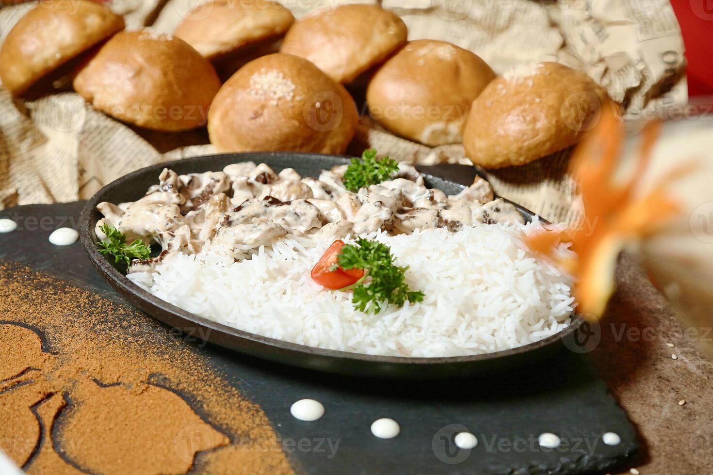 Close Up of Steaming Plate of Food on Restaurant Table photo