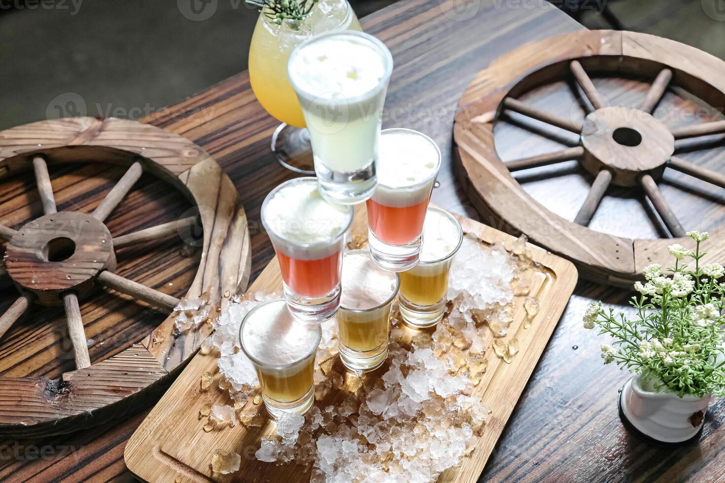 Wooden Table With Glasses Filled With Drinks photo