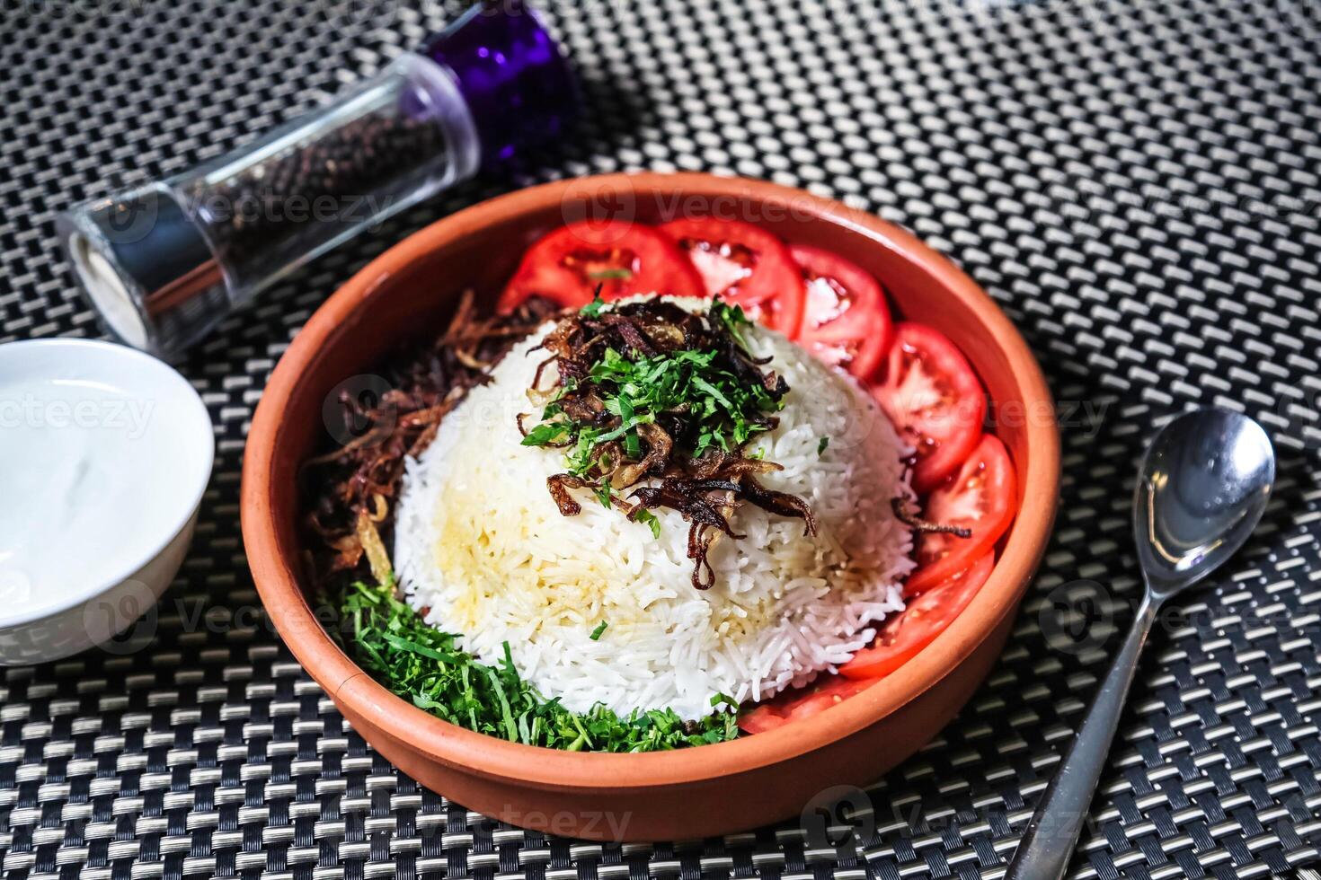 Bowl of Rice With Tomatoes and Herbs photo