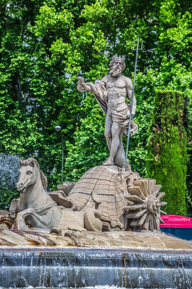 Fountain of Neptune Fuente de Neptuno one of the most famous landmark of Madrid, Spain photo