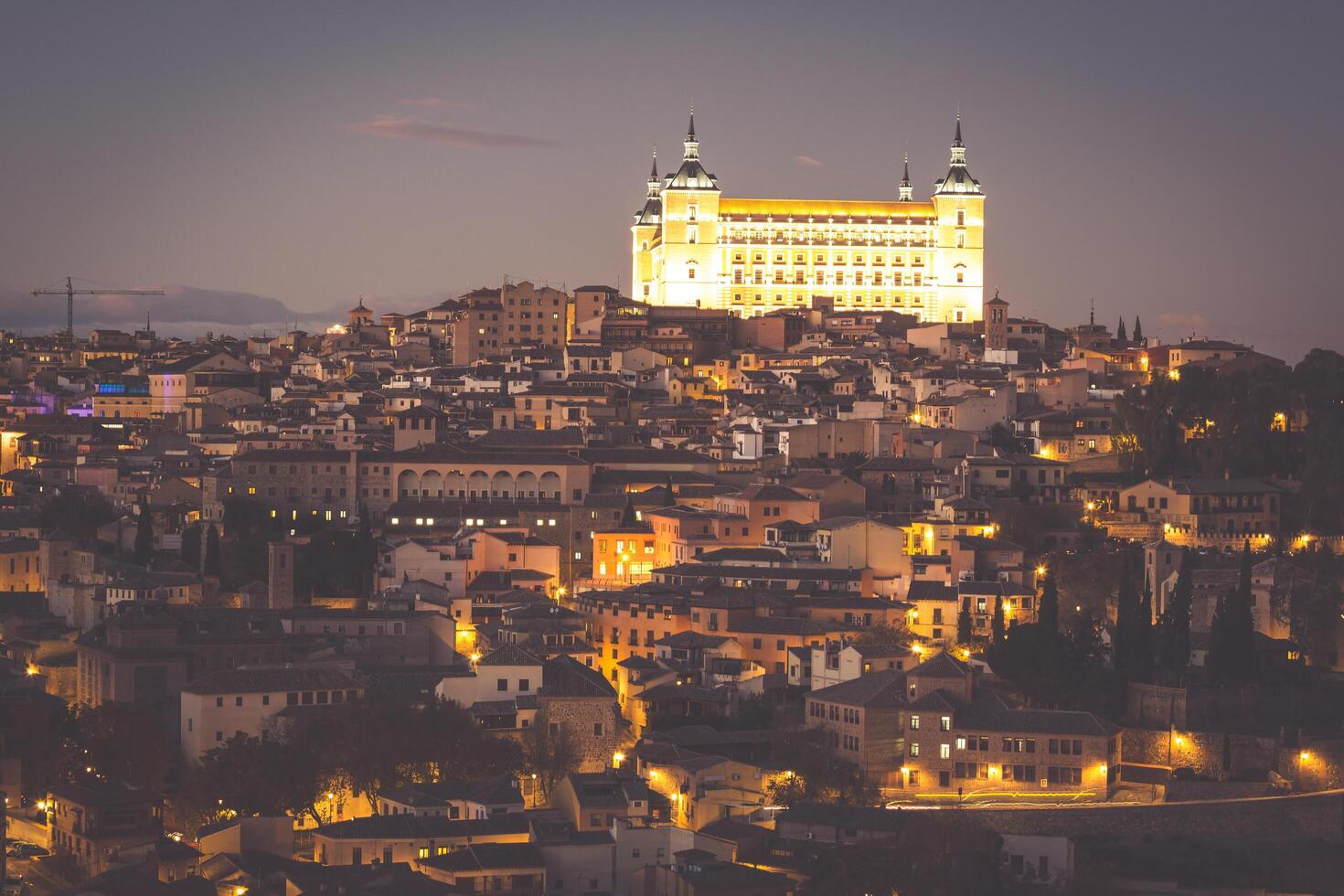 Toledo Cityscape with Alcazar at dusk in Madrid Spain photo