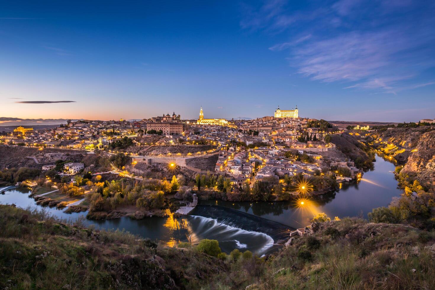 Toledo Cityscape with Alcazar at dusk in Madrid Spain photo