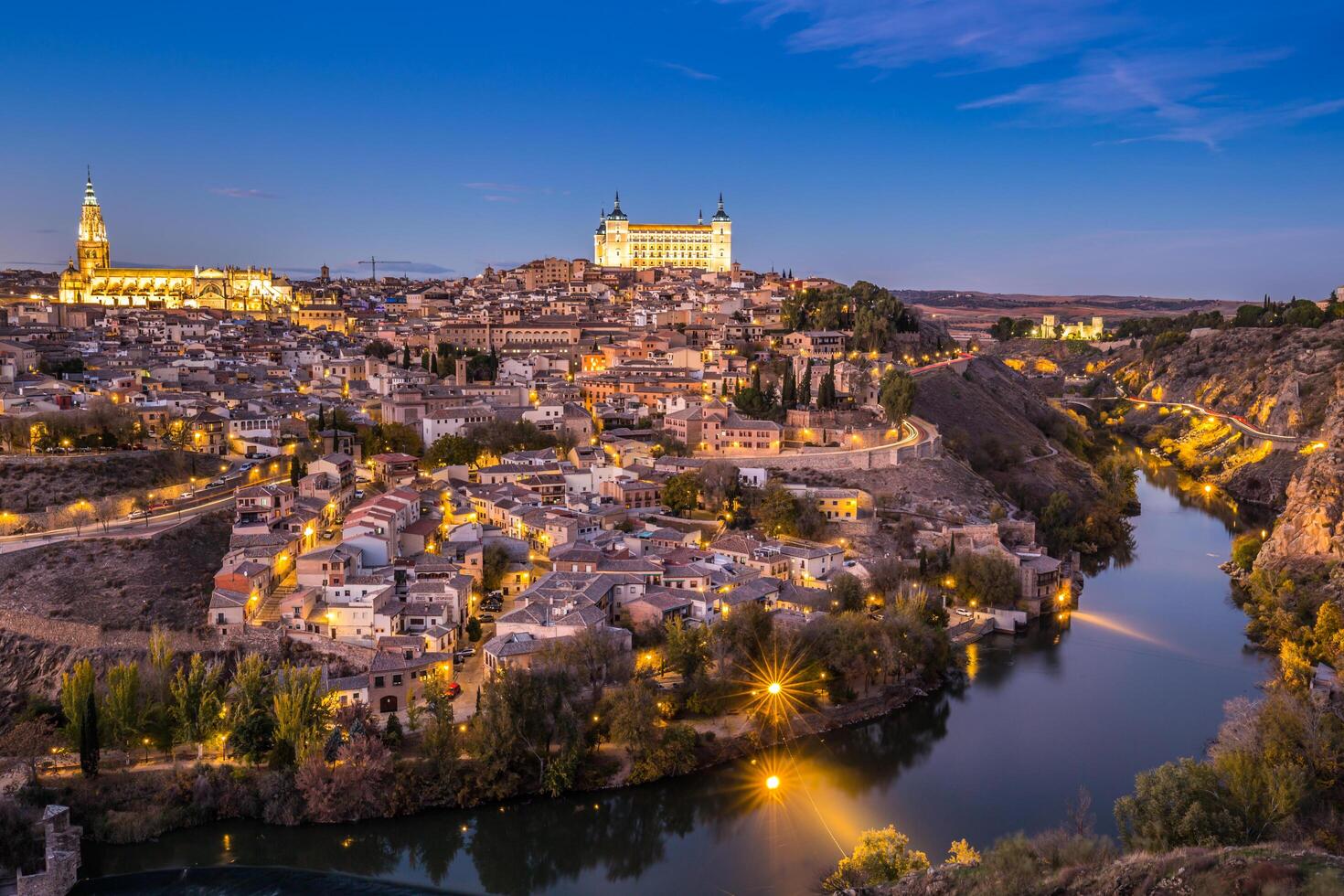 Toledo Cityscape with Alcazar at dusk in Madrid Spain photo