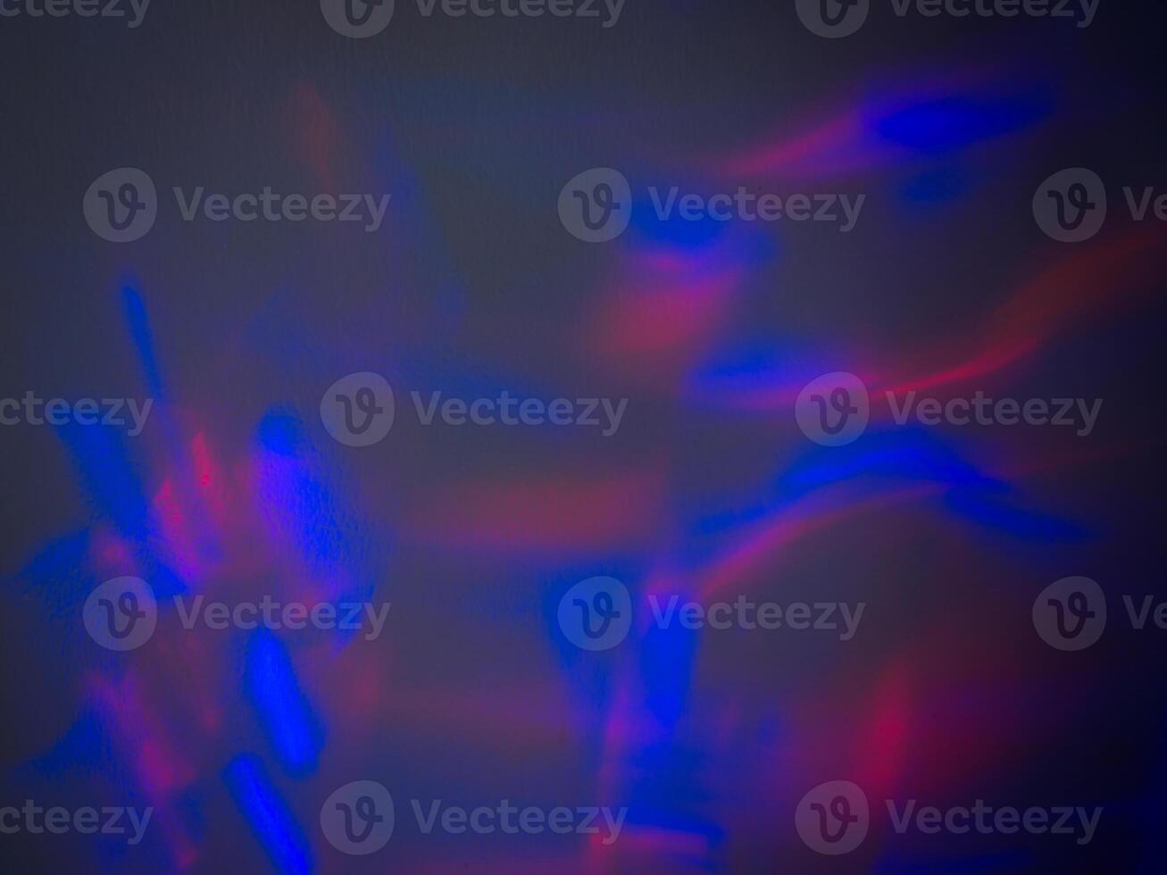 Light reflections at night on the wall in the dark for a party. photo