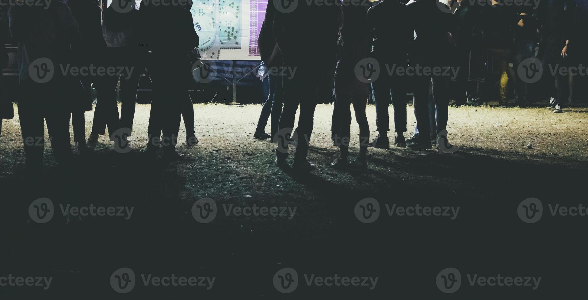 Human legs of people which waiting for music festival. photo