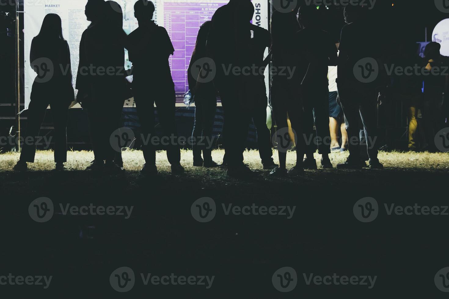 Human legs of people which waiting for music festival. photo