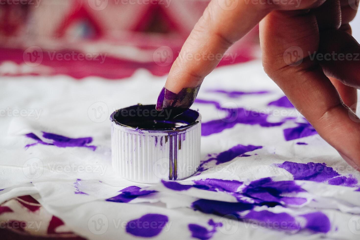 Close up portrait of little finger dipping into purple ink after voting for Indonesia President and Government Election 2024 photo