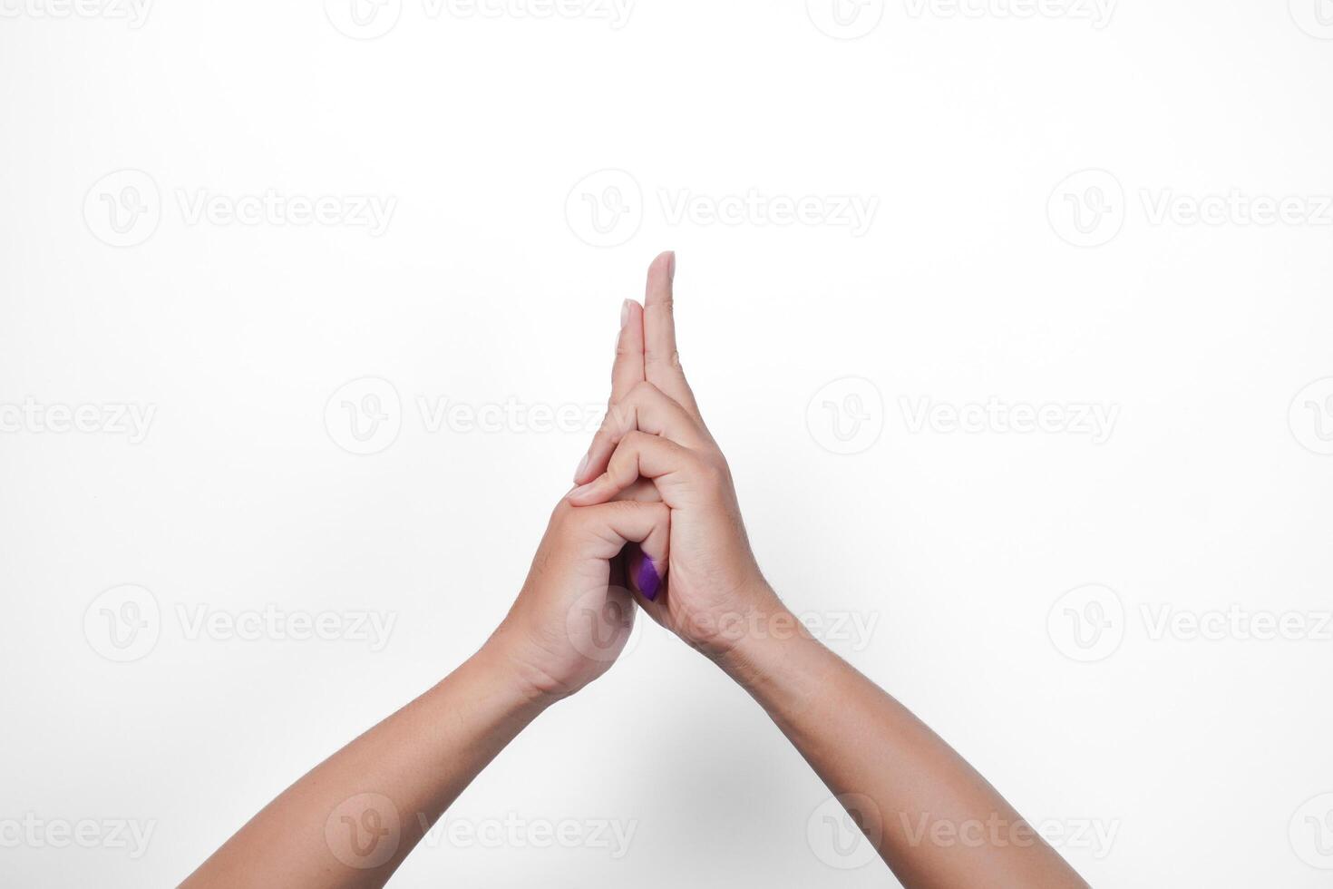 Portrait of a hand making Japanese ninja gesture on isolated white background photo