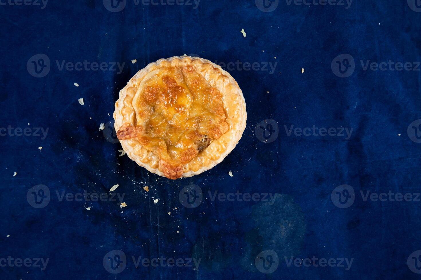 Mushroom Vol au vent isolated on blue background top view of savory snack food photo