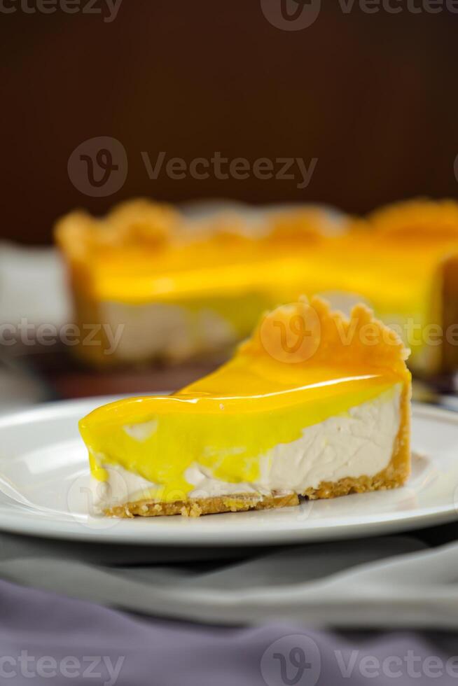Fresh Lemon Cheesecake slice with fork and knife served in plate isolated on napkin top view cafe bake food photo