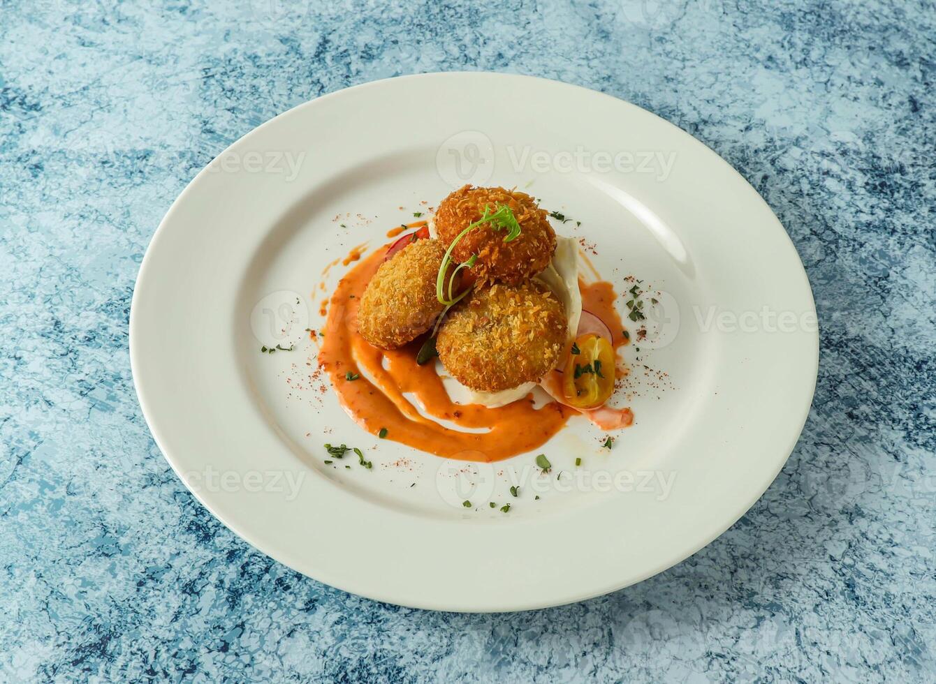 Crab Cakes served in plate isolated on background top view of italian food photo