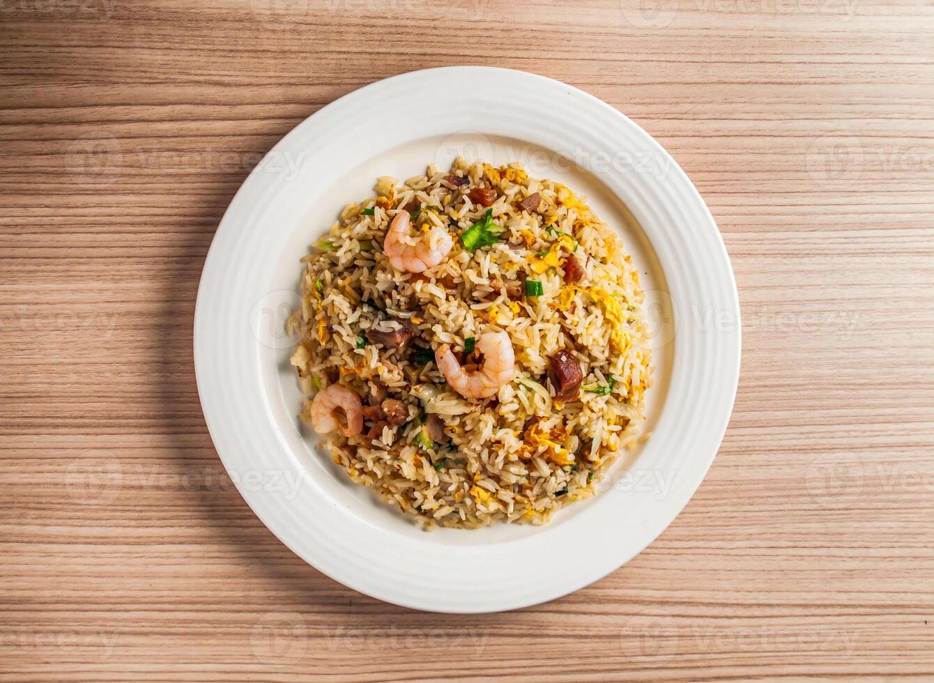 yangzhou fried rice with shrimp, prawn and eggs served in dish isolated on table top view of hong kong food photo