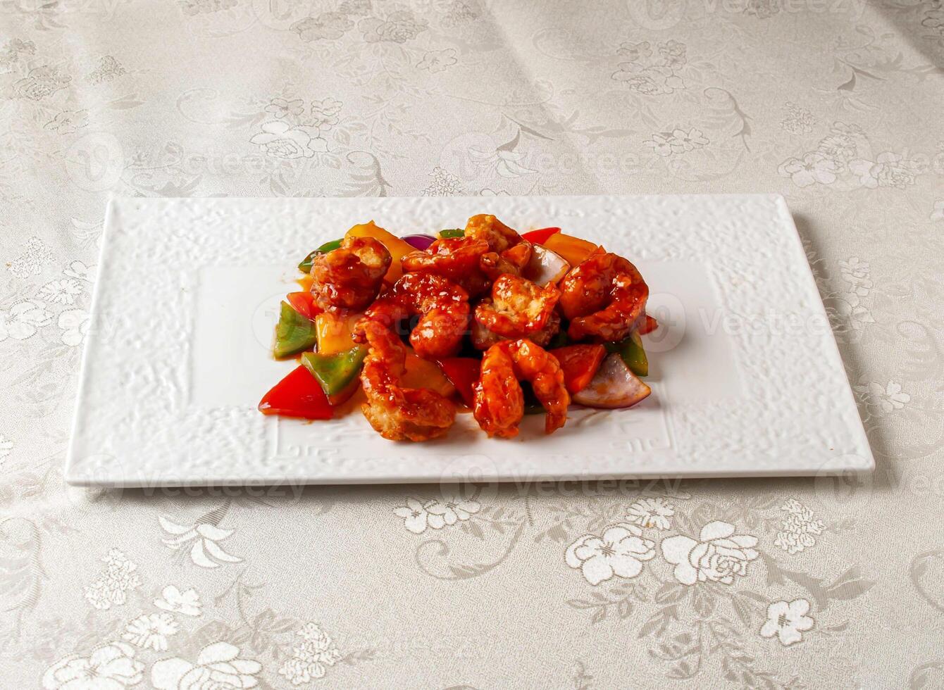 Sweet and Sour Prawn Balls served dish isolated on background top view of hong kong chinese food photo