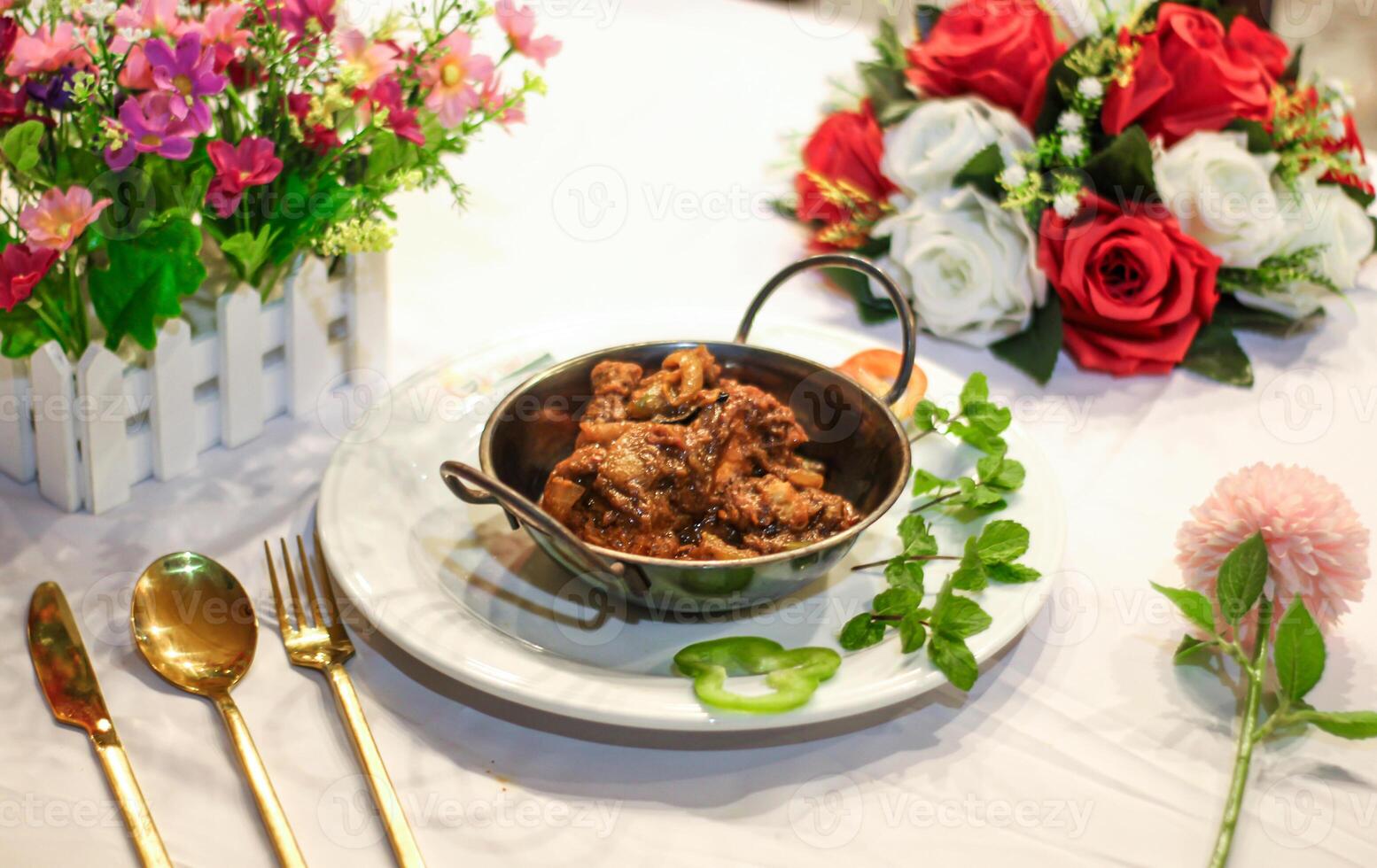 Spicy Chicken karahi or korai korma masala served in dish isolated on table side view of indian spices food photo