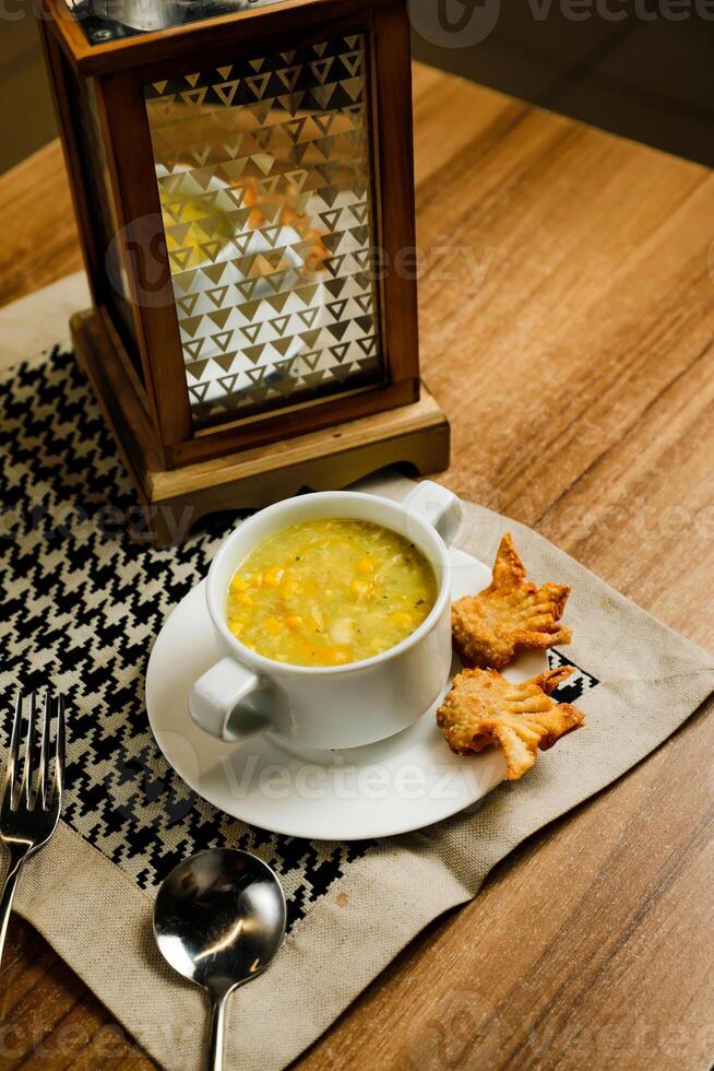 Sweet Corn Chicken Soup served in bowl isolated on napkin side view of chinese soup photo