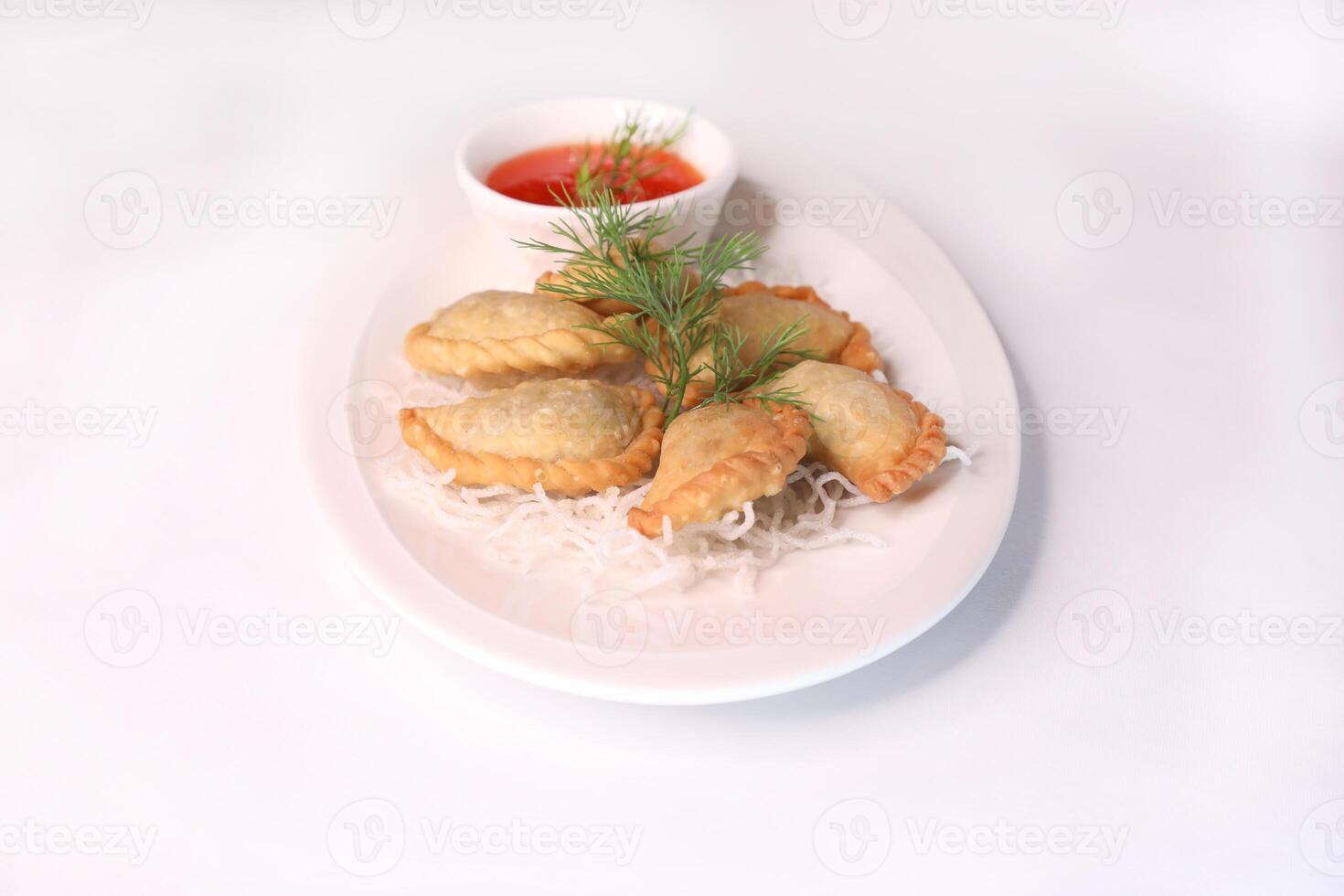 MEAT FATAYER with chilli sauce served in dish isolated on background side view of arab food photo