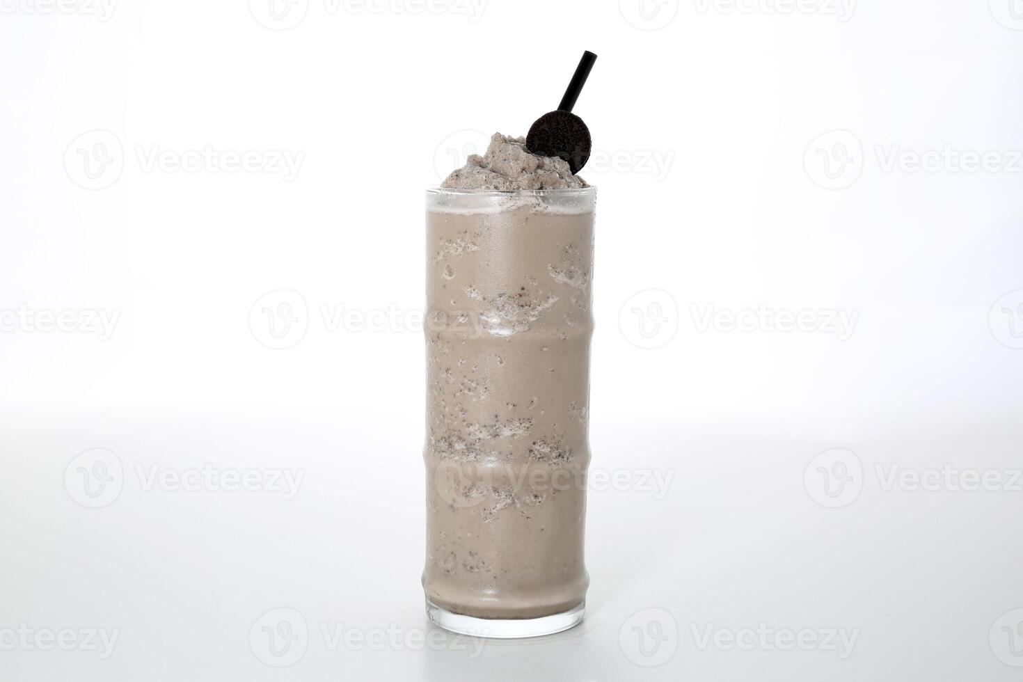 Oreo Shake with straw served in glass isolated on grey background side view of healthy morning arabic drink photo