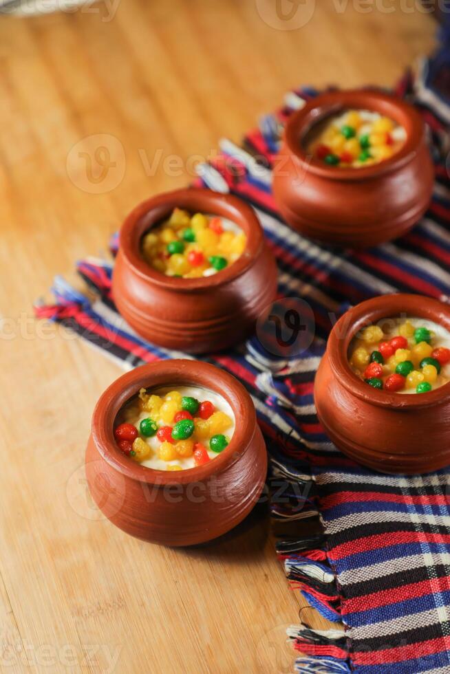 Moondi rabri milk kheer served in pot isolated on mat top view of indian, bangali and pakistani dessert mithai photo