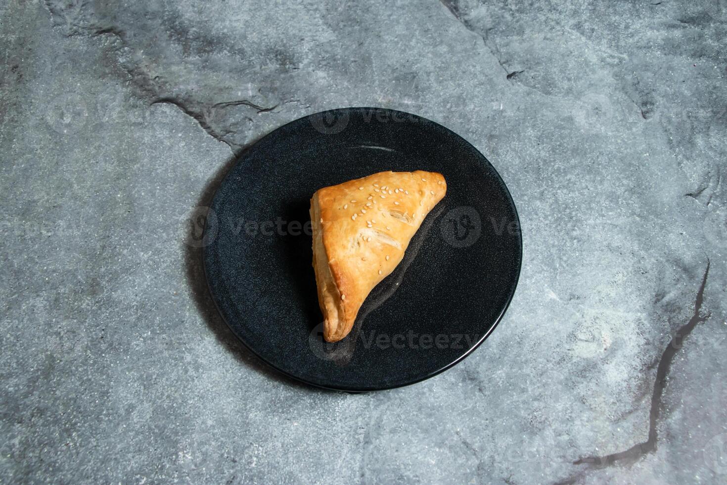 Creamy chicken mushroom puff pastry snack served in plate isolated on background top view of baked food indian dessert photo