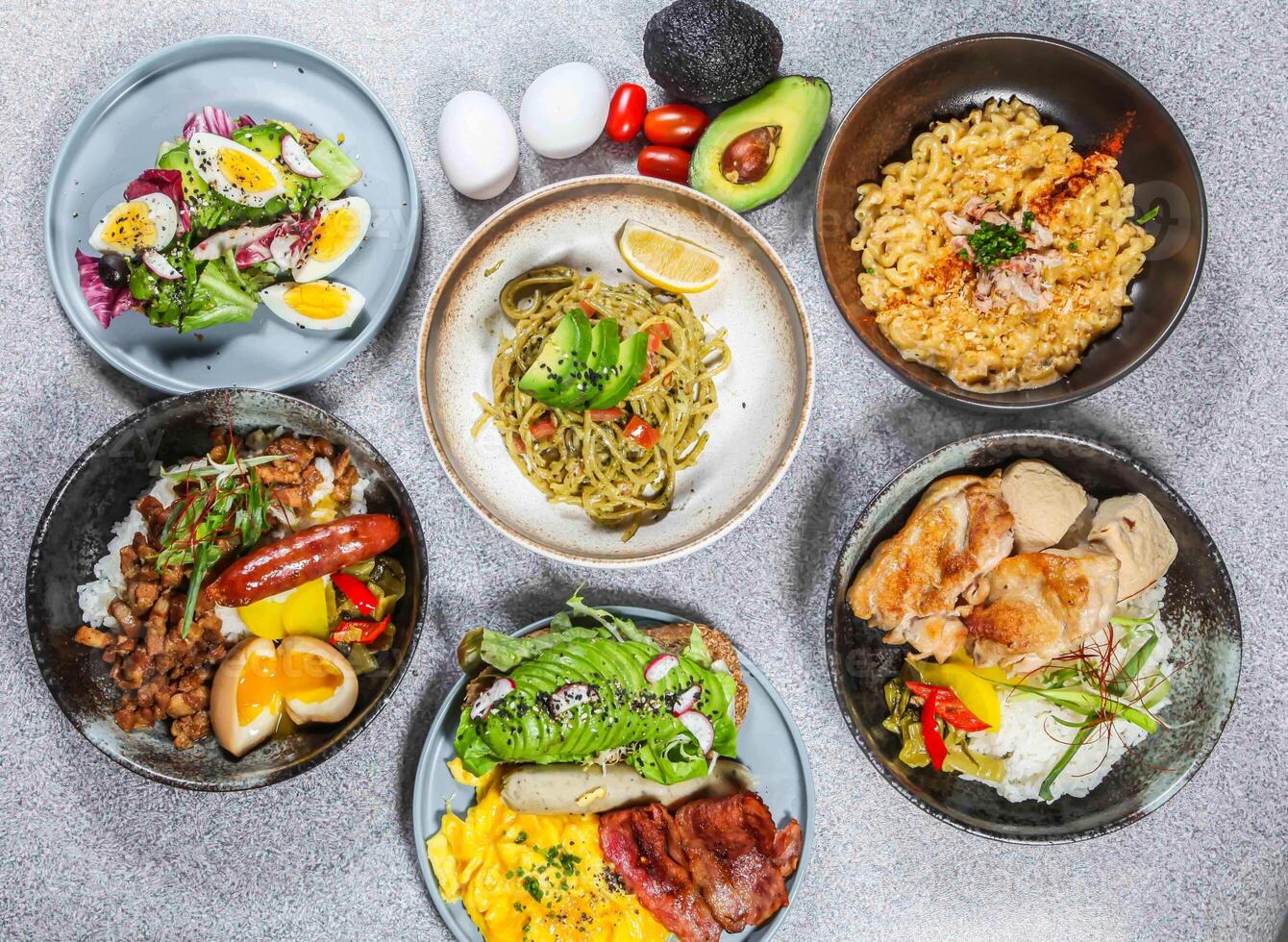 Chili Fried Egg, Avocado Spaghetti, Cheesy Crab Pasta, Braised Pork Rice, Avocado Toast English Breakfast, Sesame Oil Chicken Rice served in dish isolated on background top view of taiwan food photo