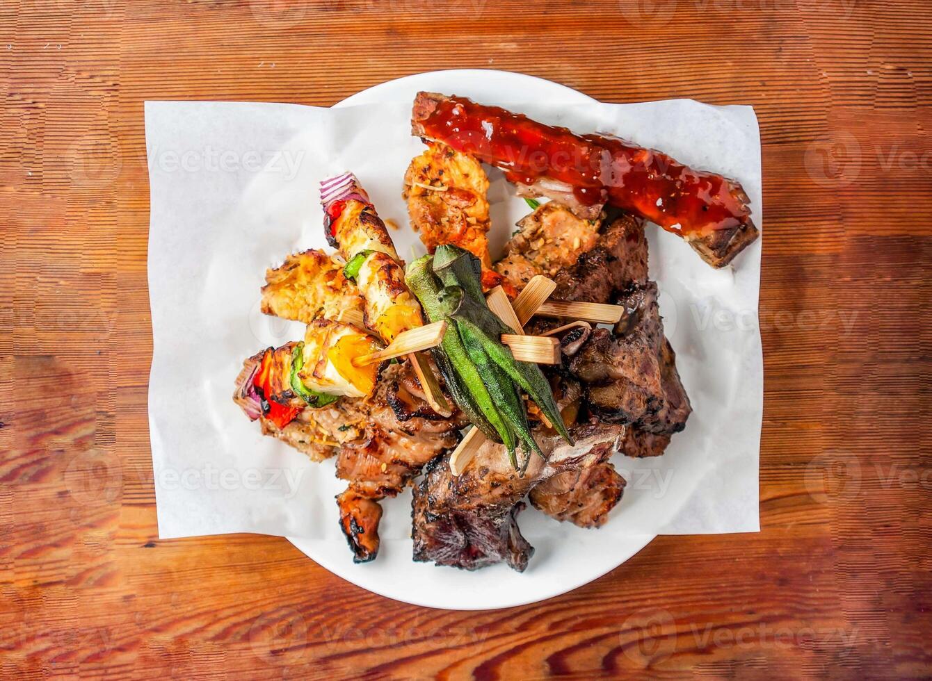 Skewers set satay with mayonnaise dip sauce served in dish isolated on wooden table top view of hong kong food photo