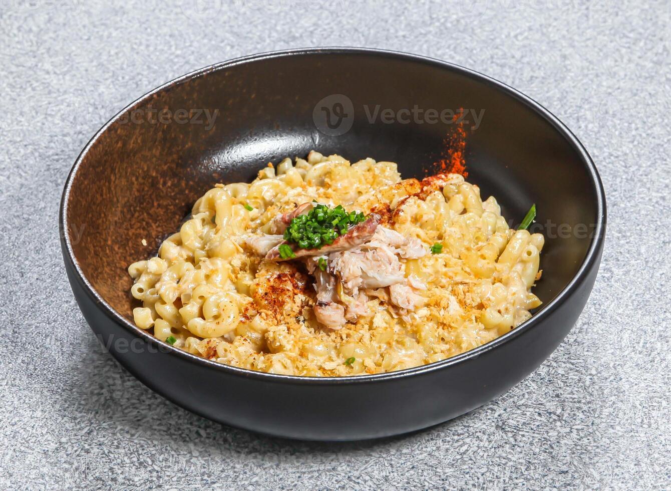 Cheesy Crab Pasta served in dish isolated on background top view of taiwan food photo