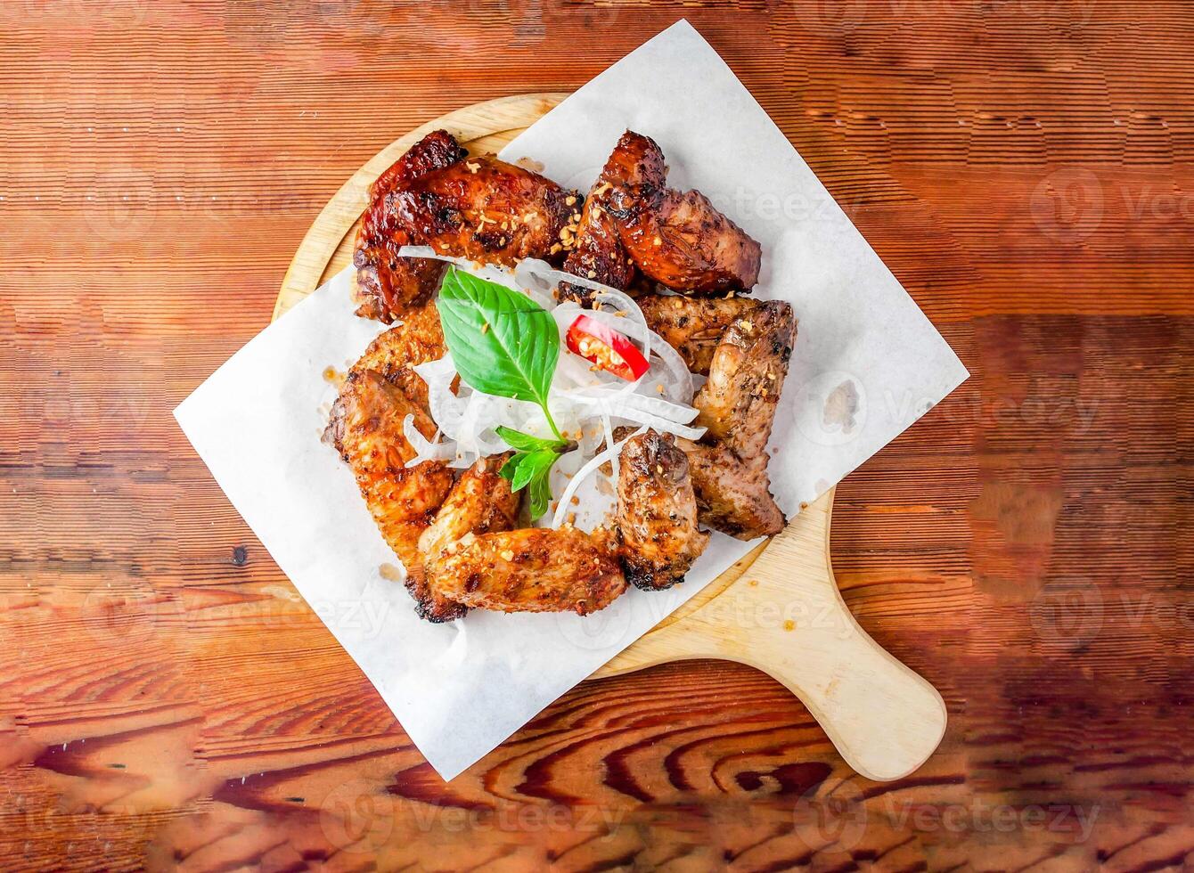 fried wings platter 12 pcs served on cutting board isolated on wooden table top view of hong kong food photo