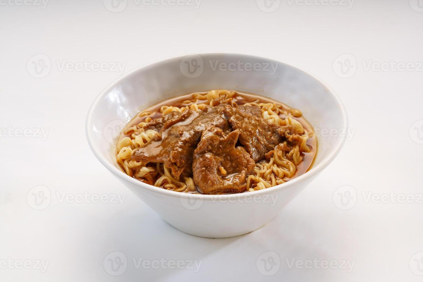 Signature Satay Beef Instant Noodles served in bowl isolated on wooden table side view of hong kong fast food photo