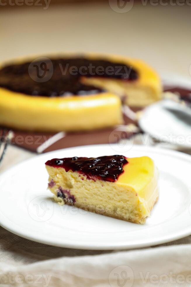 Blueberry Cheesecake slice include caramel with fork and knife served in plate isolated on table top view of cafe bake food photo